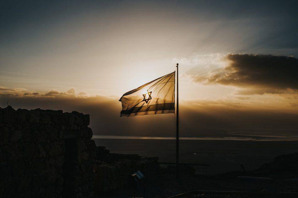 Israel flag swinging in the wind.